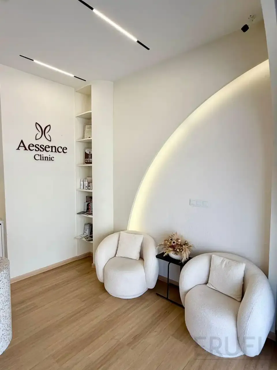 Waiting lounge with Aessence Clinic signage at the Penang branch
