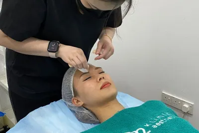 O2 Clinic: Aesthetician performing a medical facial at O2 Klinik